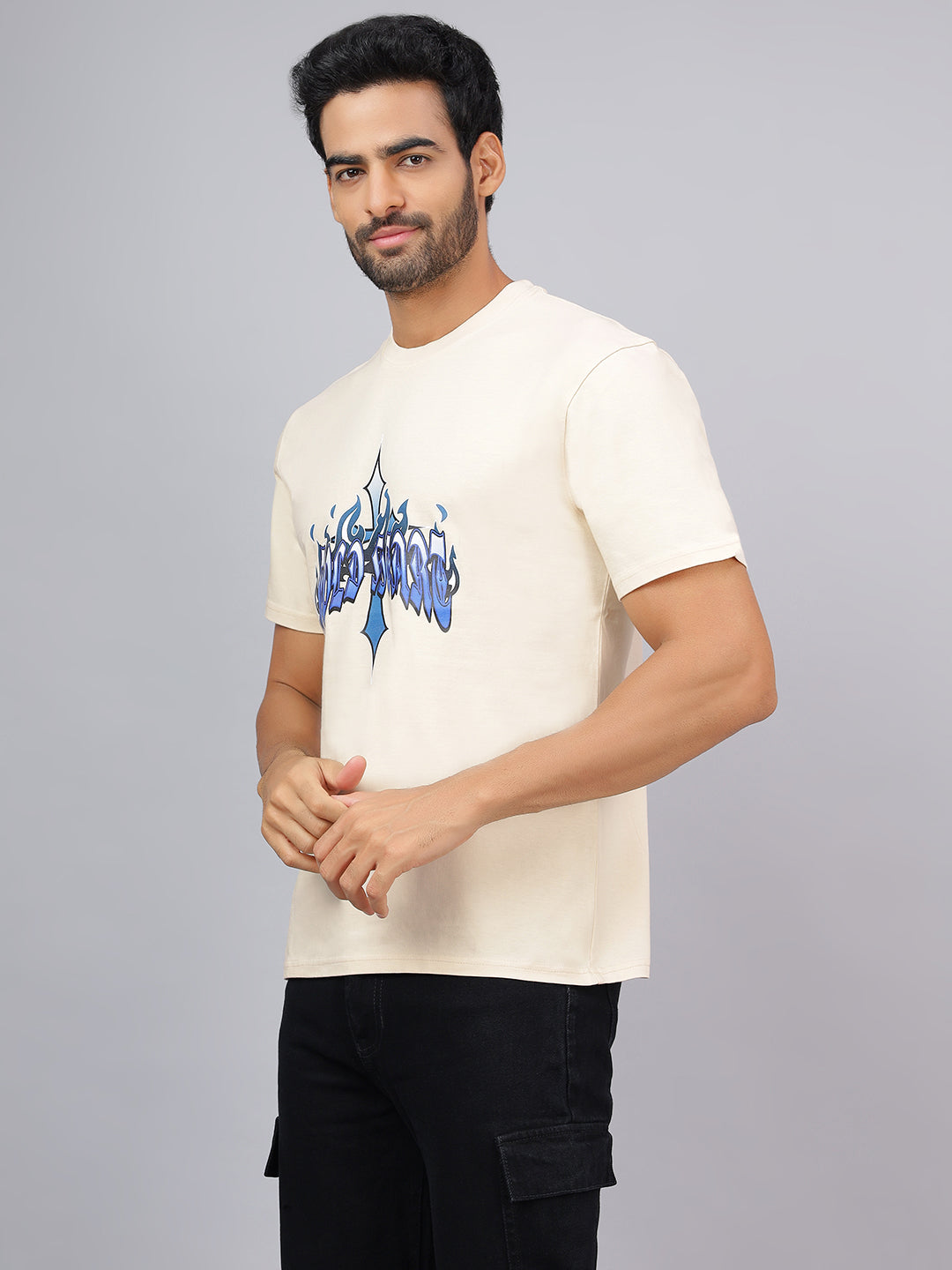 Man wearing a white t-shirt with blue graphics on a gray background