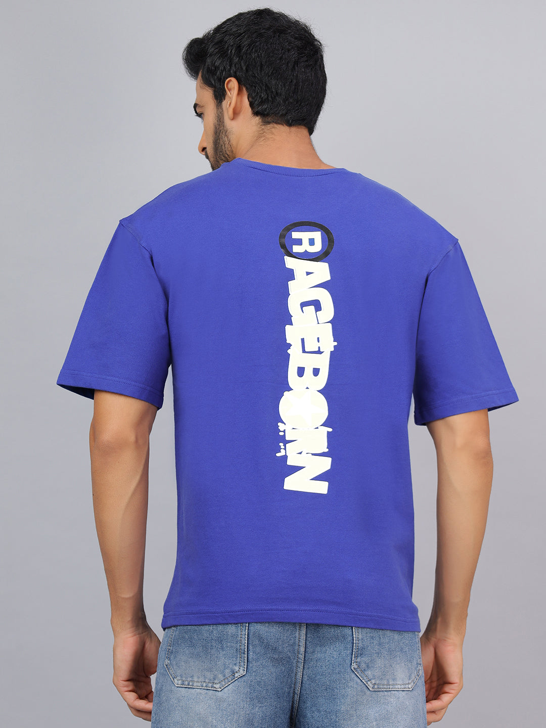 Person wearing a blue t-shirt with 'Rageborn' branding on the back against a gray background