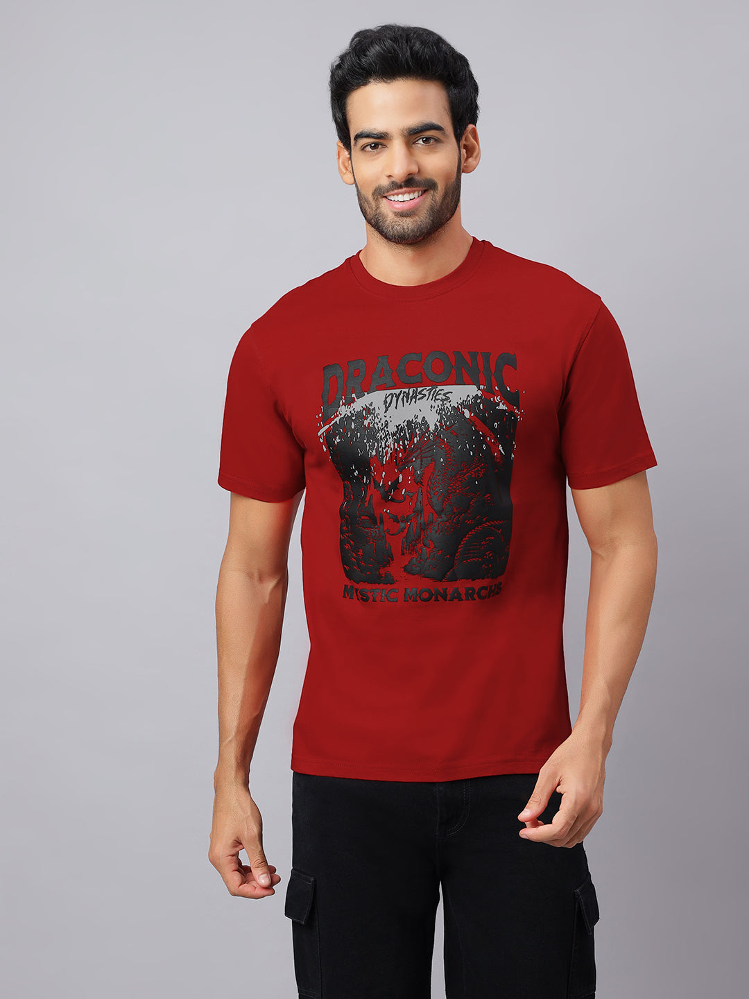 Man wearing a red t-shirt with graphic design on a gray background