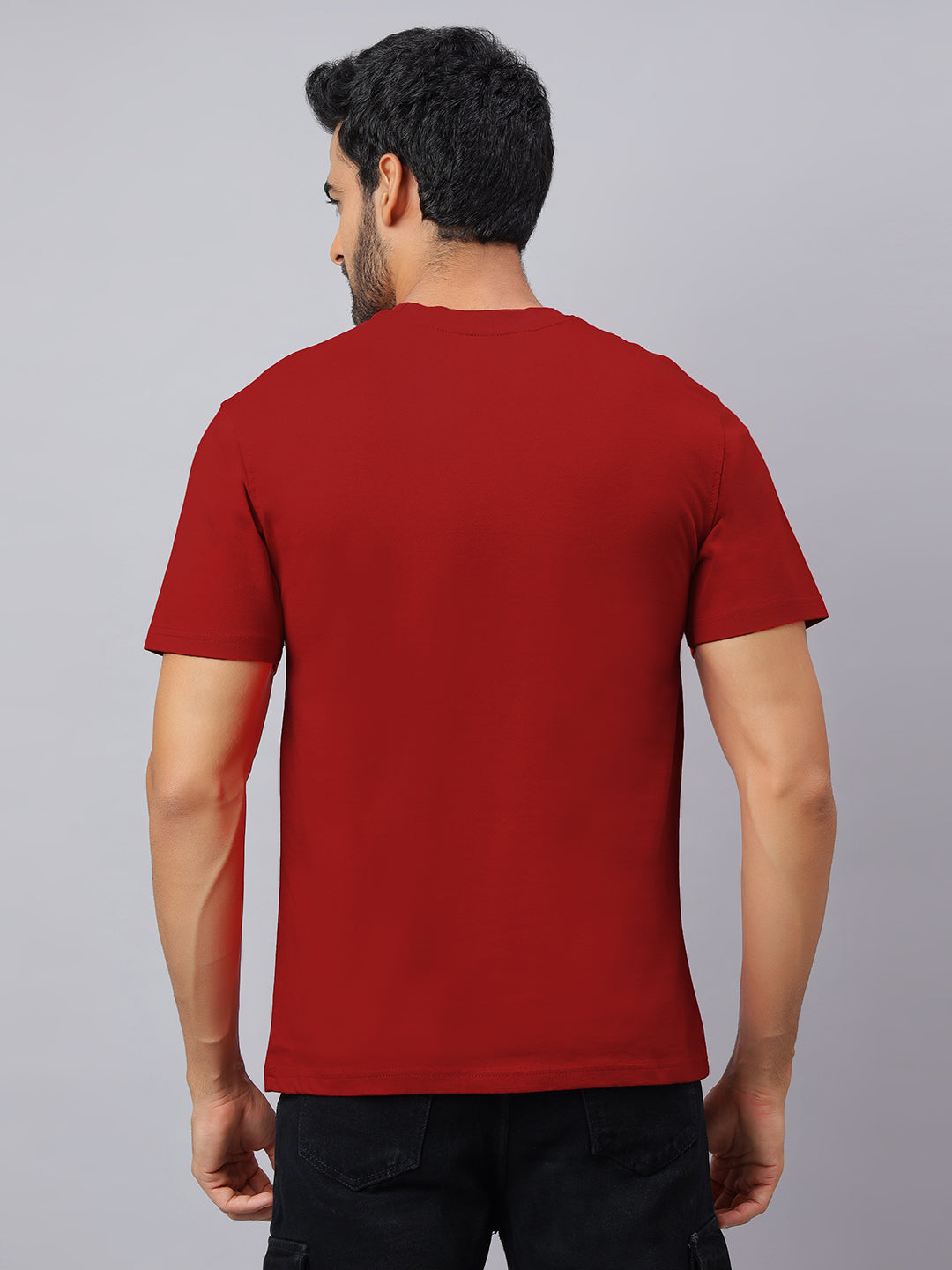 Man wearing a red t-shirt on a gray background