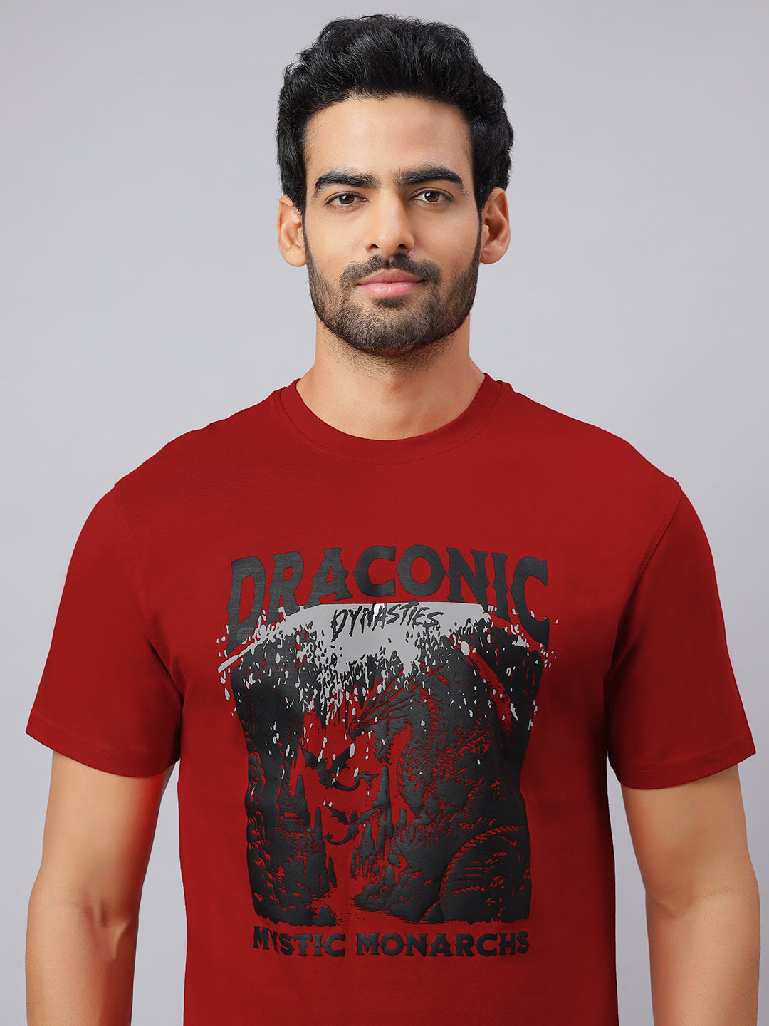 Man wearing a red t-shirt with a graphic design and text on a gray background