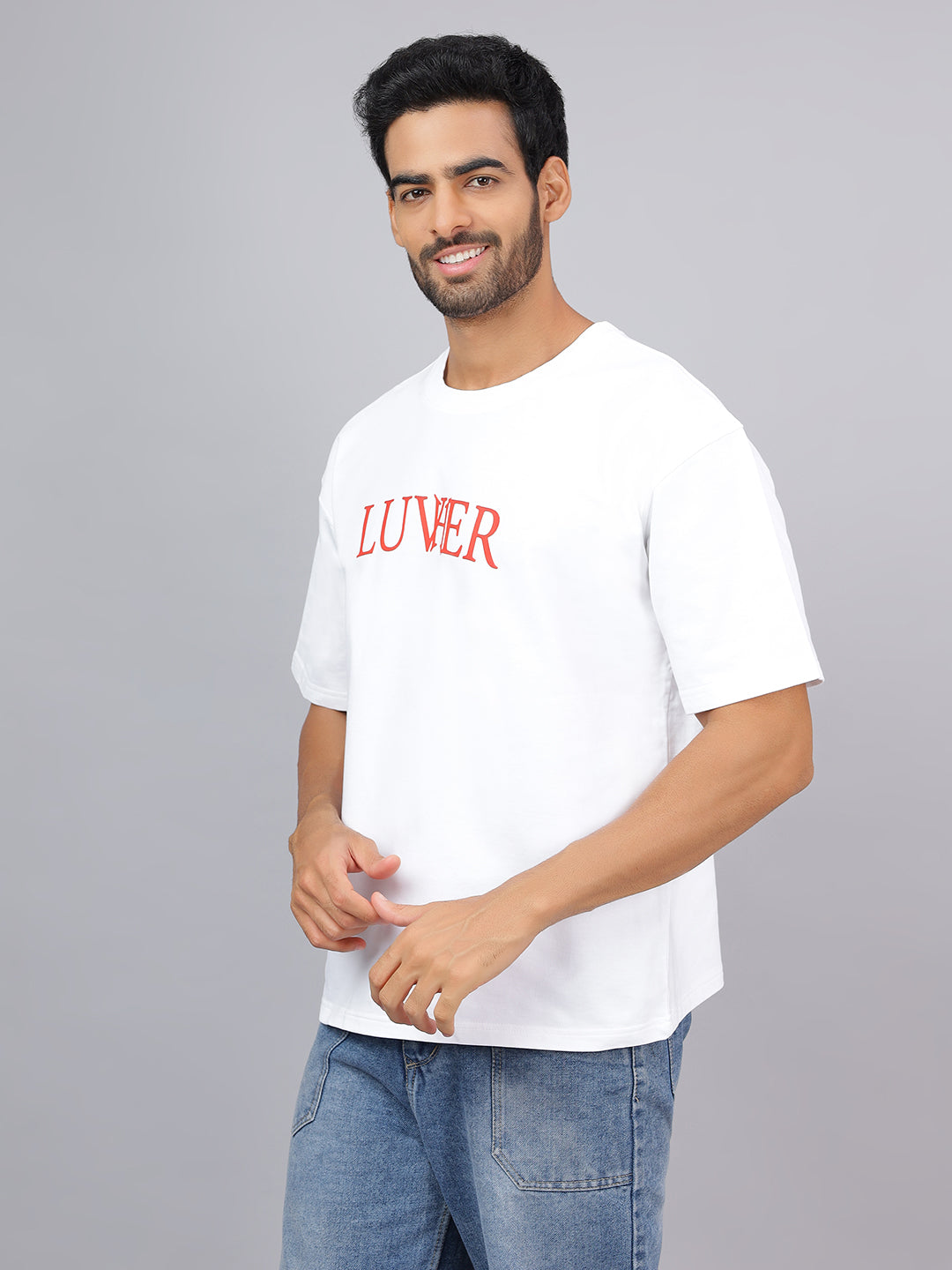 Man wearing a white t-shirt with 'LUVER' printed in red on a gray background