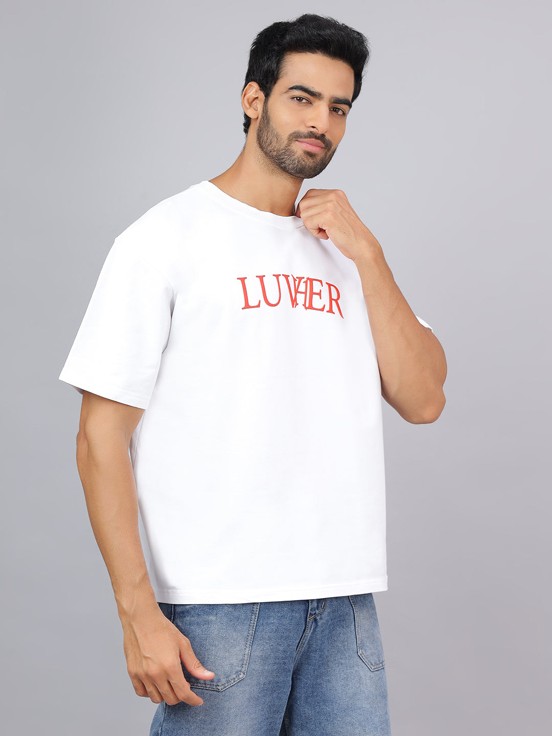 Man wearing a white t-shirt with 'LUVIER' printed in red on a gray background